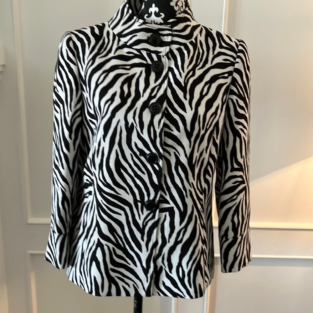 Zebra print lined jacket with button front.